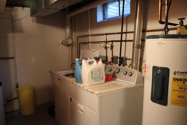 421 River St, Merrimac, WI 53561 - laundry area with water heater, concrete block wall, and separate washer and dryer