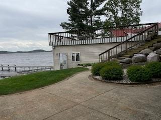 421 River St, Merrimac, WI 53561 - view of side of home with stairway and a water view