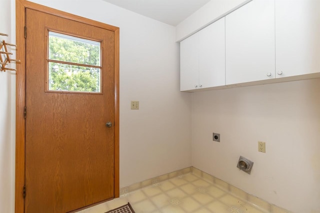 306 W Michigan St, Appleton, WI 54911 - laundry room with electric dryer hookup, cabinet space, and baseboards