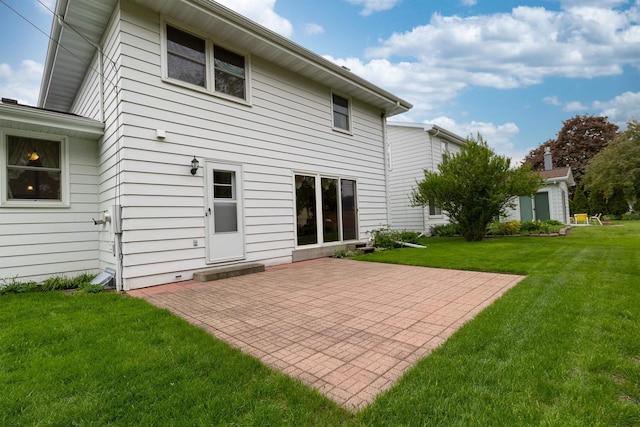 306 W Michigan St, Appleton, WI 54911 - rear view of property featuring a patio and a yard