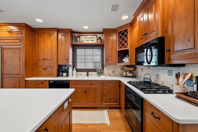 2522 Martha Ave, Green Bay, WI 54301 - kitchen with black appliances, a sink, open shelves, brown cabinetry, and recessed lighting