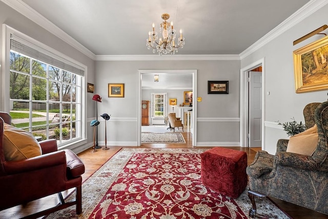 2522 Martha Ave, Green Bay, WI 54301 - living room featuring wood finished floors, a chandelier, ornamental molding, and baseboards