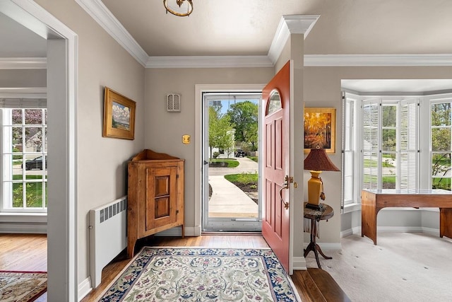 2522 Martha Ave, Green Bay, WI 54301 - entrance foyer featuring radiator, ornamental molding, baseboards, and light wood-style floors