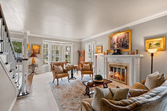 2522 Martha Ave, Green Bay, WI 54301 - living room featuring light colored carpet, ornamental molding, stairs, baseboards, and a glass covered fireplace