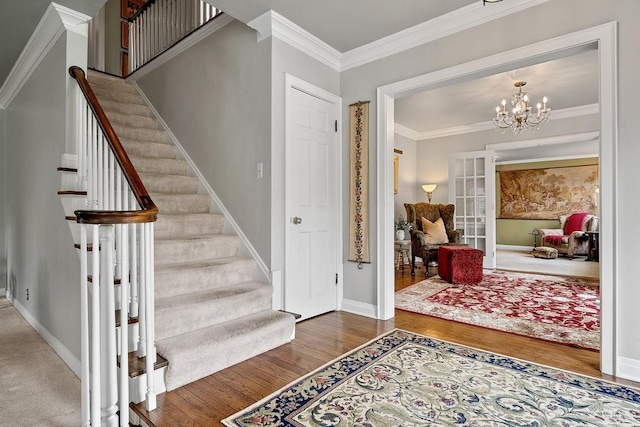 2522 Martha Ave, Green Bay, WI 54301 - entrance foyer featuring wood finished floors, stairway, crown molding, a chandelier, and baseboards
