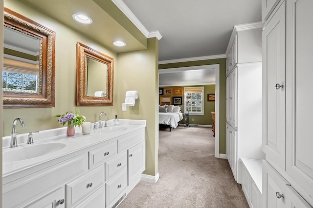 2522 Martha Ave, Green Bay, WI 54301 - ensuite bathroom featuring double vanity, crown molding, baseboards, carpet, and recessed lighting
