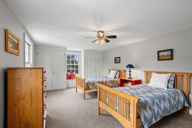2522 Martha Ave, Green Bay, WI 54301 - carpeted bedroom with two closets and a ceiling fan