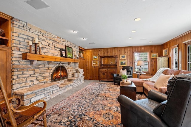 2522 Martha Ave, Green Bay, WI 54301 - living room featuring wood walls, a fireplace, recessed lighting, and ornamental molding