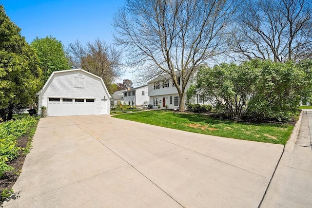 2522 Martha Ave, Green Bay, WI 54301 - view of front of property with an outdoor structure, a garage, a front yard, and a gambrel roof
