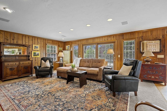 2522 Martha Ave, Green Bay, WI 54301 - living room with plenty of natural light, wooden walls, recessed lighting, and ornamental molding