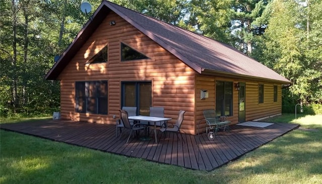 7431 Jordan Buck Trl, Danbury, WI 54830 - back of house featuring a wooden deck, log veneer siding, and a lawn
