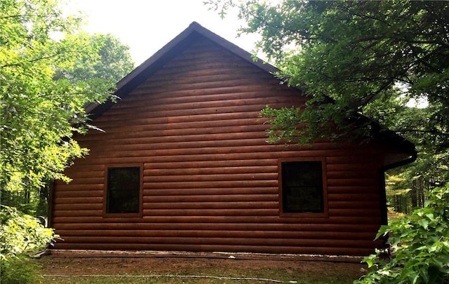 7431 Jordan Buck Trl, Danbury, WI 54830 - view of home's exterior with log veneer siding
