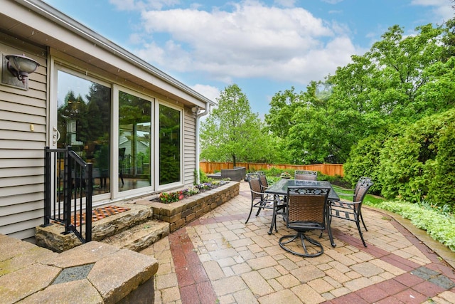 884 Joshua Ct, Pewaukee, WI 53072 - fenced backyard with outdoor dining area and a patio
