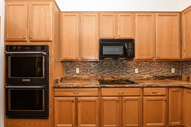 884 Joshua Ct, Pewaukee, WI 53072 - kitchen with black appliances, tasteful backsplash, and dark stone countertops