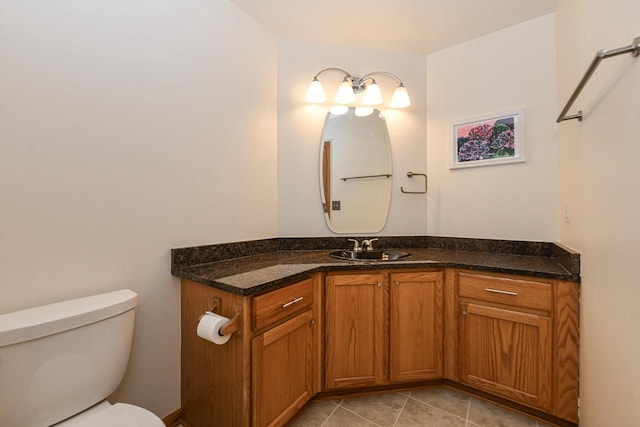 884 Joshua Ct, Pewaukee, WI 53072 - half bath featuring toilet, vanity, and tile patterned floors