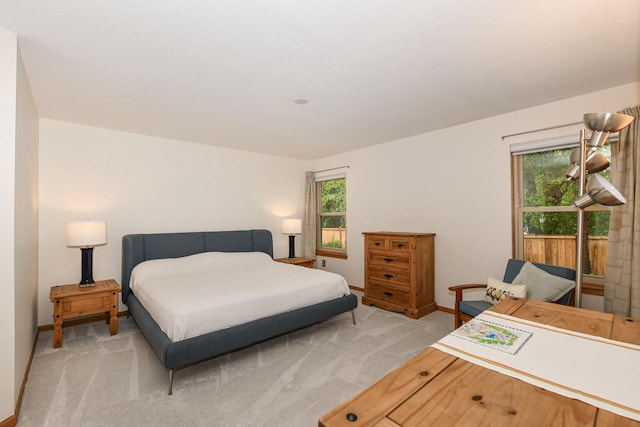 884 Joshua Ct, Pewaukee, WI 53072 - bedroom featuring baseboards and light colored carpet