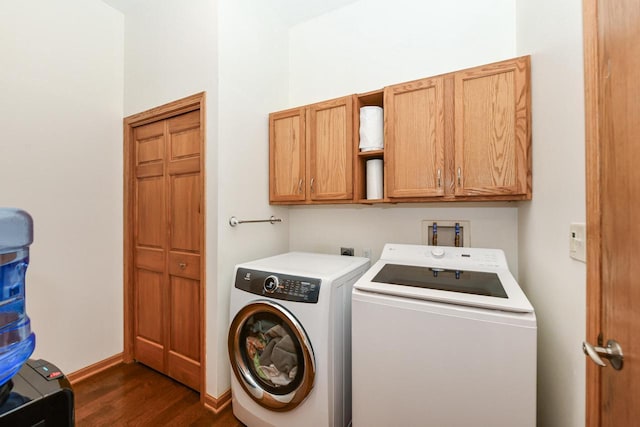 884 Joshua Ct, Pewaukee, WI 53072 - washroom featuring dark wood finished floors, cabinet space, washing machine and dryer, and baseboards