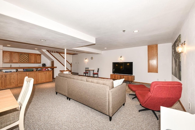 884 Joshua Ct, Pewaukee, WI 53072 - living room featuring light colored carpet, stairway, bar area, and recessed lighting