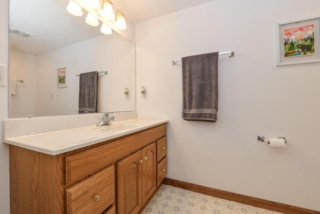 884 Joshua Ct, Pewaukee, WI 53072 - bathroom with tile patterned floors, baseboards, and vanity