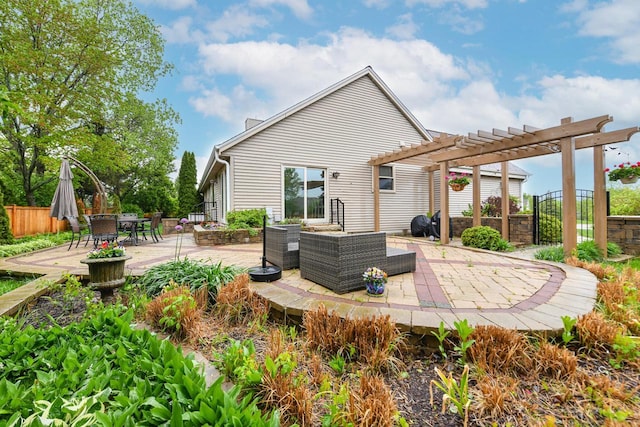 884 Joshua Ct, Pewaukee, WI 53072 - rear view of property with a pergola, a patio, outdoor dining space, and an outdoor living space
