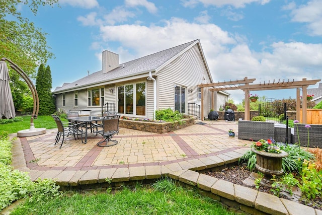 884 Joshua Ct, Pewaukee, WI 53072 - rear view of house featuring a pergola, a chimney, and a patio