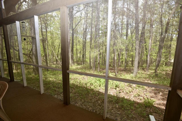 W1829 Broken Bow Rd, Keshena, WI 54135 - unfurnished sunroom featuring a forest view