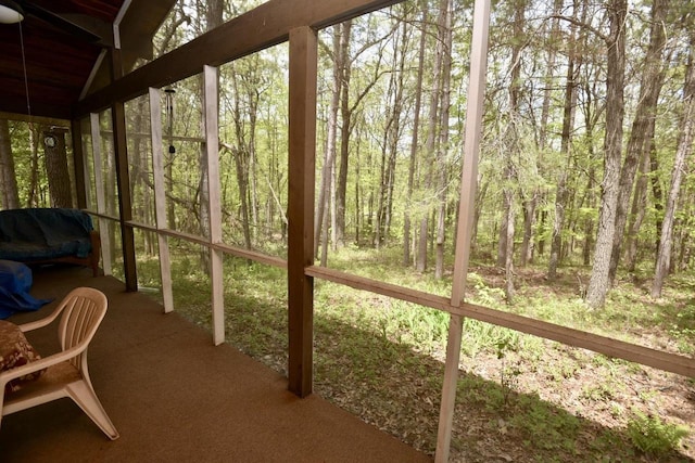 W1829 Broken Bow Rd, Keshena, WI 54135 - sunroom / solarium featuring a view of trees and vaulted ceiling