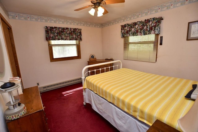W1829 Broken Bow Rd, Keshena, WI 54135 - carpeted bedroom with baseboard heating, multiple windows, and a ceiling fan