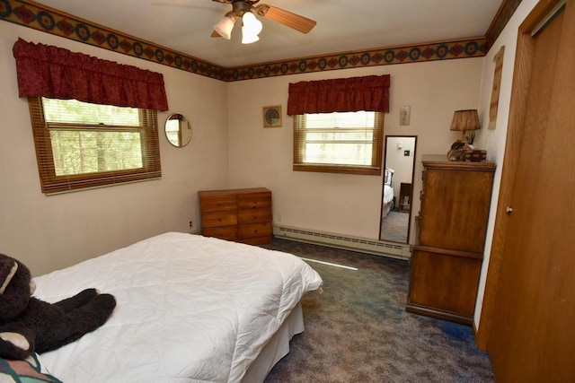 W1829 Broken Bow Rd, Keshena, WI 54135 - carpeted bedroom featuring a baseboard radiator and ceiling fan