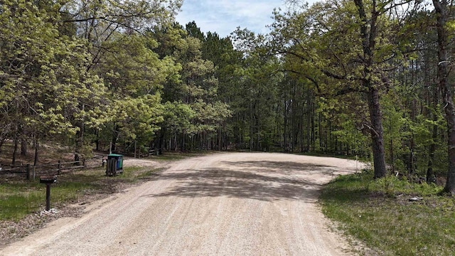 W1829 Broken Bow Rd, Keshena, WI 54135 - view of dirt / gravel road with a forest view