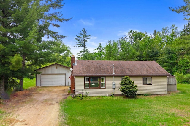 1163 Chicago Ln, Friendship, WI 53934 - view of front of home featuring a chimney, a garage, a front yard, and an outbuilding