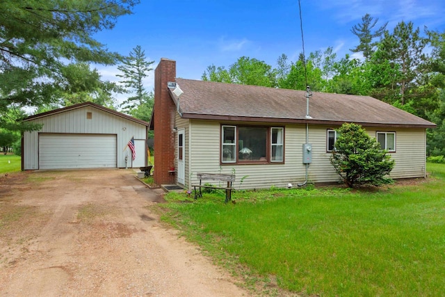 1163 Chicago Ln, Friendship, WI 53934 - ranch-style house with an outbuilding, a chimney, a garage, and a front yard