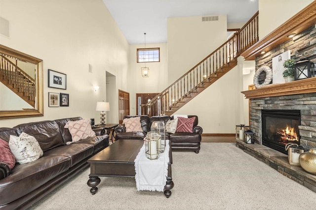 4700 Beaver Dam Rd, Stevens Point, WI 54482 - living room with stairs, a towering ceiling, carpet, a fireplace, and baseboards