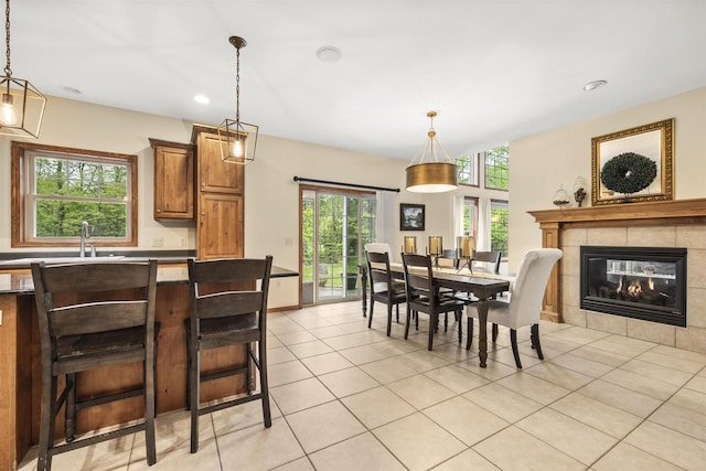 4700 Beaver Dam Rd, Stevens Point, WI 54482 - dining space featuring light tile patterned flooring, recessed lighting, and a tile fireplace