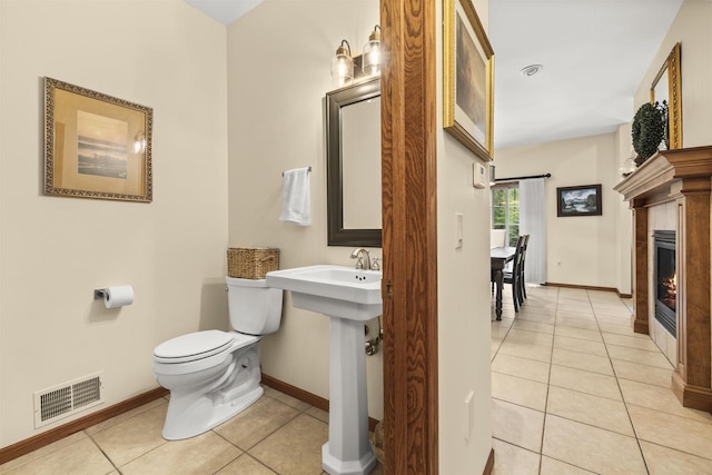 4700 Beaver Dam Rd, Stevens Point, WI 54482 - bathroom featuring tile patterned floors, toilet, and baseboards