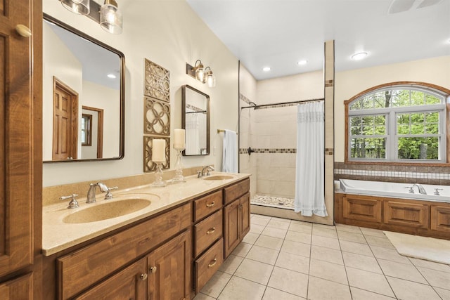 4700 Beaver Dam Rd, Stevens Point, WI 54482 - bathroom featuring tile patterned flooring, a tile shower, a garden tub, and double vanity