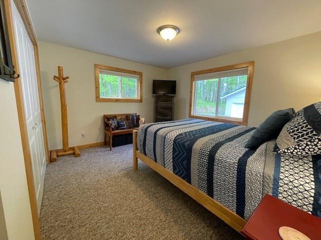 12757 County Highway T, Hayward, WI 54843 - carpeted bedroom featuring baseboards