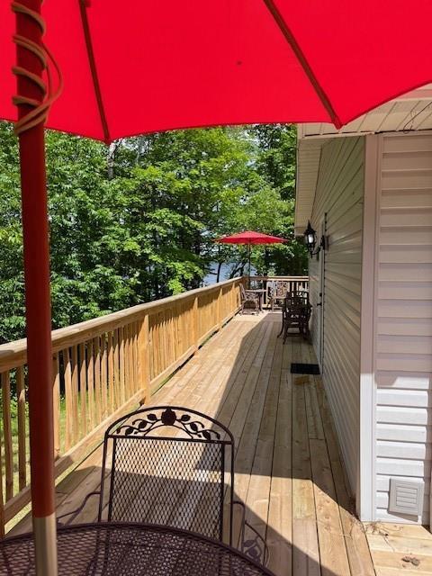 12757 County Highway T, Hayward, WI 54843 - wooden terrace with outdoor dining space