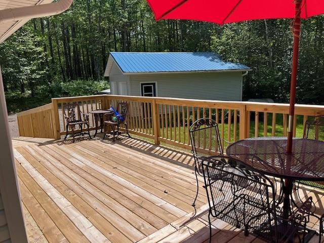 12757 County Highway T, Hayward, WI 54843 - wooden terrace featuring outdoor dining area