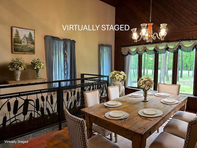 N3615 Badger Ave, Chili, WI 54420 - dining room with a chandelier, wood finished floors, and lofted ceiling