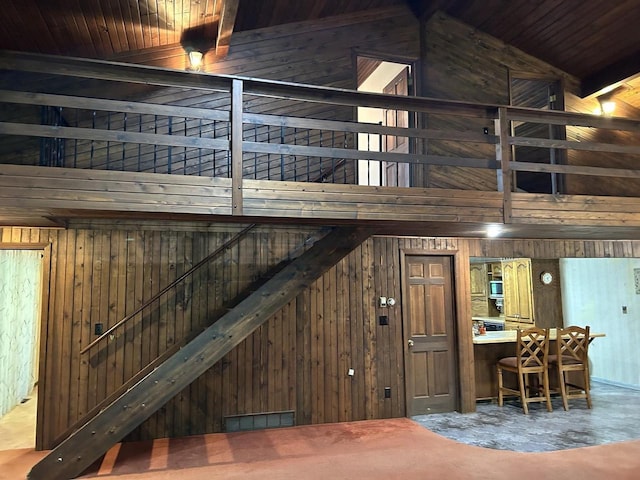 N3615 Badger Ave, Chili, WI 54420 - stairway with wooden walls, carpet flooring, wooden ceiling, and vaulted ceiling
