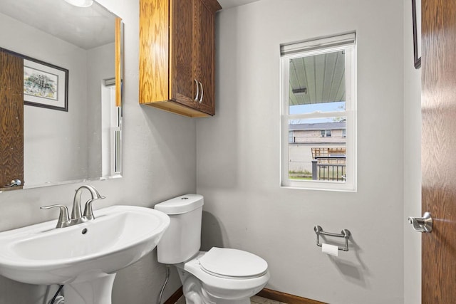 1306 Nelson St, Green Bay, WI 54304 - half bath with toilet, a sink, and baseboards