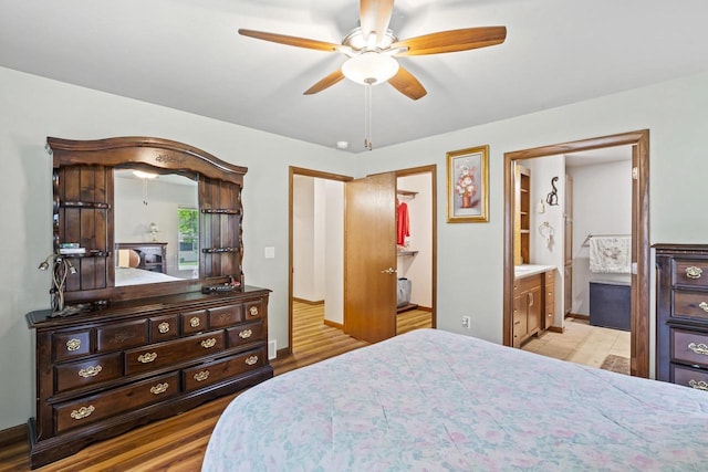 1306 Nelson St, Green Bay, WI 54304 - bedroom featuring wood finished floors, connected bathroom, and ceiling fan