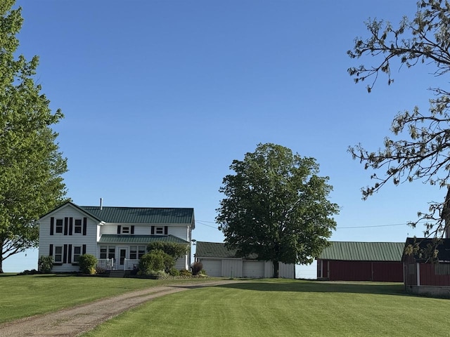 W13491 Reeds Corners Rd, Ripon, WI 54971 - view of green lawn with a garage and an outdoor structure
