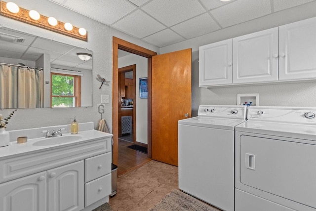 W13491 Reeds Corners Rd, Ripon, WI 54971 - laundry area with separate washer and dryer, a textured wall, and light tile patterned floors