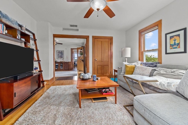 W13491 Reeds Corners Rd, Ripon, WI 54971 - living area featuring a ceiling fan, light wood finished floors, and baseboards