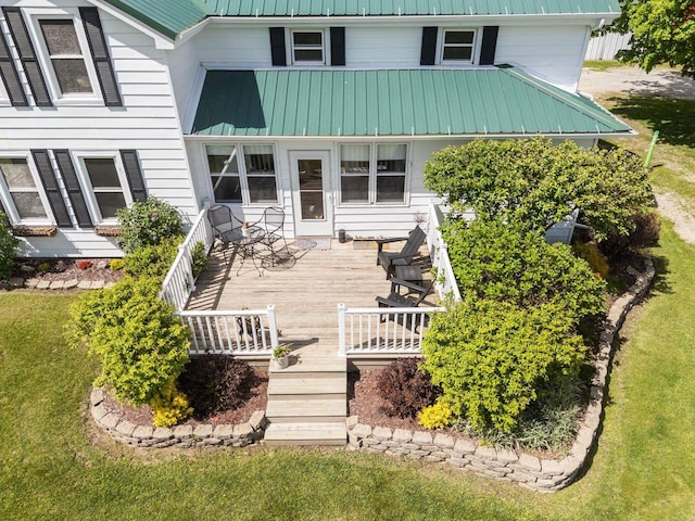 W13491 Reeds Corners Rd, Ripon, WI 54971 - rear view of property with metal roof, a lawn, and a deck