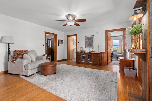 W13491 Reeds Corners Rd, Ripon, WI 54971 - living area featuring a ceiling fan, wood finished floors, and baseboards