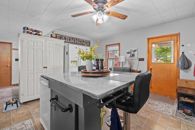 W13491 Reeds Corners Rd, Ripon, WI 54971 - kitchen featuring white refrigerator with ice dispenser, stone tile floors, ceiling fan, and dishwasher