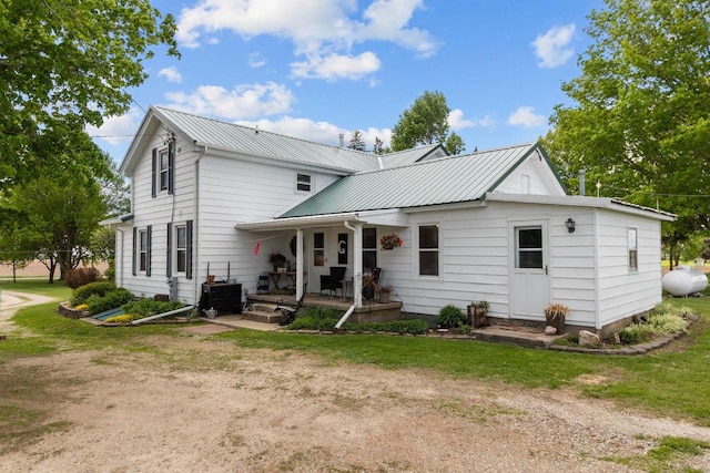 W13491 Reeds Corners Rd, Ripon, WI 54971 - rear view of property with a porch and metal roof